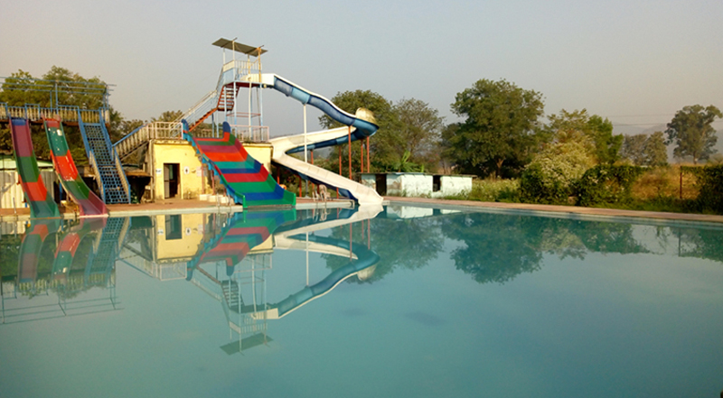 swimming pool with farmhouse